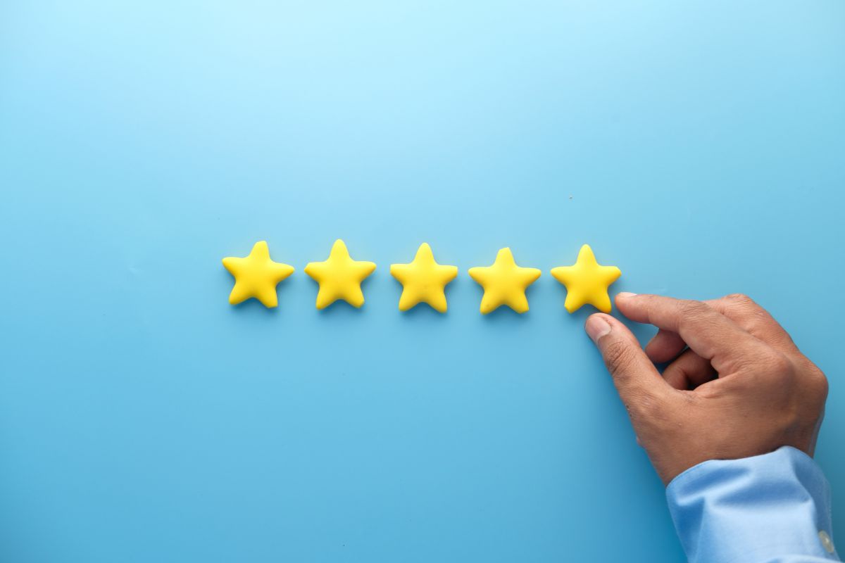 Five gold stars representing a five-star Google review, illustrating how online reviews build trust and drive enquiries for local businesses